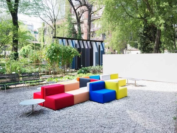 A composition of Cabrio armchairs in an open space