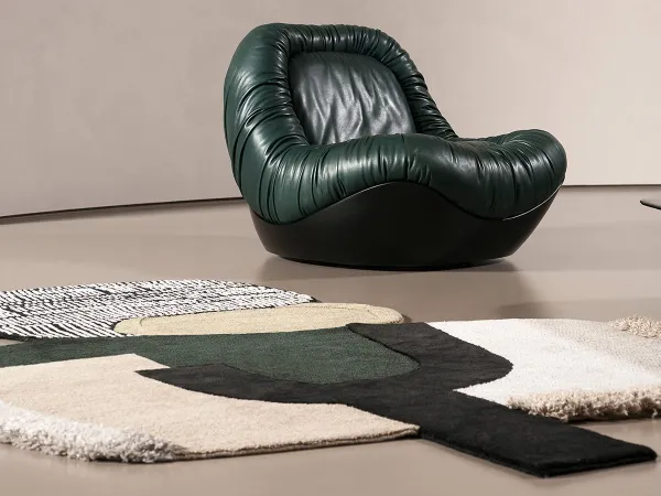 Himani D rug and Barret armchair by Baxter