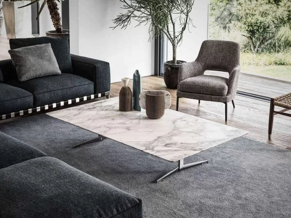 The Joyce armchair and Fly coffee table by Flexform