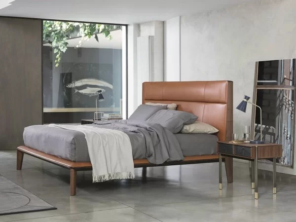 Nyan bed by Porada with leather headboard
