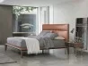 Nyan bed by Porada with leather headboard
