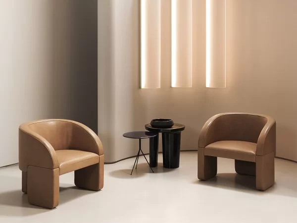 The Lazybones armchair by Baxter in a living area