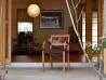 The Garbo little armchair by Porada in a living area