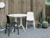 Sharky by Kristalia in an outdoor space