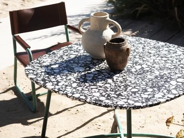 Baxter Rimini table in an outdoor space