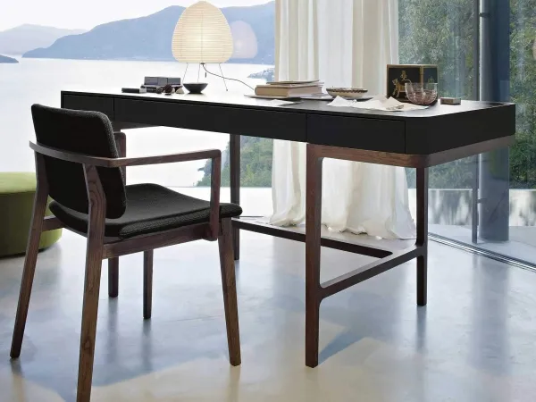 The Victor writing desk by Lema in a living area