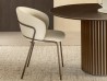 The Vela chair by Riflessi in a dining area