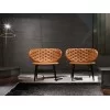 A couple of Dalma armchairs by Baxter