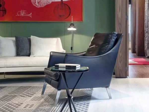 Blue version of the Boss armchair by Flexform