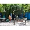 Baxter Manila armchair in an outdoor space
